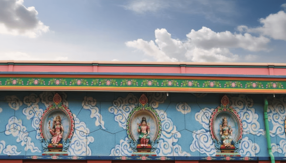 Statues of Hindu gods are around the temple grounds, showcasing intricate carvings and rich cultural symbolism